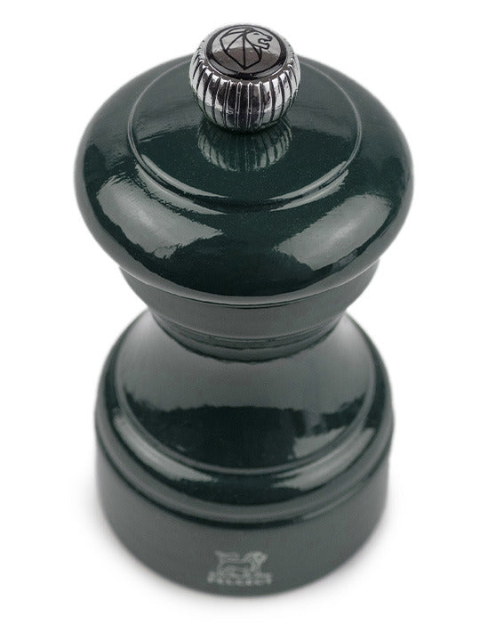 Peugeot | Bistro Pepper Mill, Forest Green: Glossy, dark-green wood pepper grinder with a metal adjustment knob, designed for fine-dining, sustainably sourced from French forests.