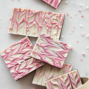 Hester & Cook | Sparkle Bark - 8 oz. features dark chocolate topped with pink-swirled white chocolate and sprinkled with peppermint candy, perfect for gourmet kitchen enthusiasts.