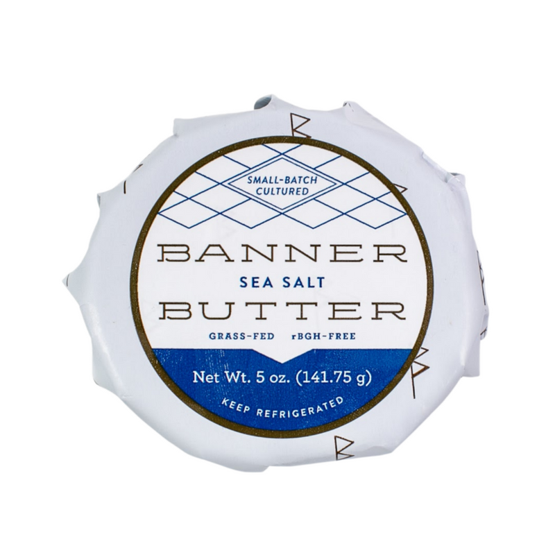 Banner Butter | Sea Salt - 5 oz package, featuring a label with white text on a blue background. Perfect for elevating grilled dishes with its savory, smoky flavor.