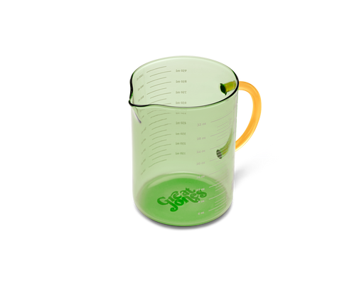 Great Jones | Beyond Measure 4-Cup - Broccoli-Butternut, a durable borosilicate glass measuring cup with precision-pour spout and clear measurements, ideal for kitchen prep and serving.
