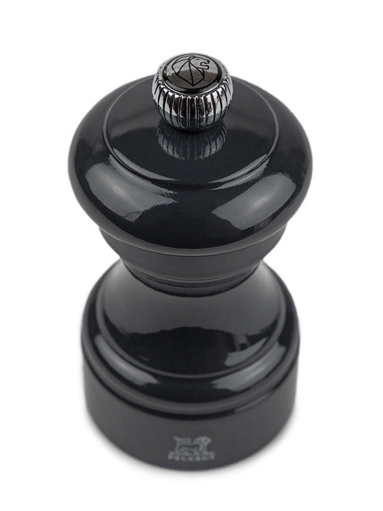 Peugeot | Bistro Pepper Mill 4 Inches, Slate Grey, features a lacquered-wood hand-turn design with an adjustable top knob for coarseness, embodying timeless elegance.