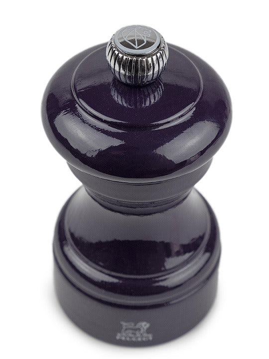 Peugeot | Bistro Salt Mill, Eggplant: A glossy, turned-wood pepper grinder with a metal adjustment knob, showcasing French craftsmanship and elegance, ideal for enhancing any kitchen setting.