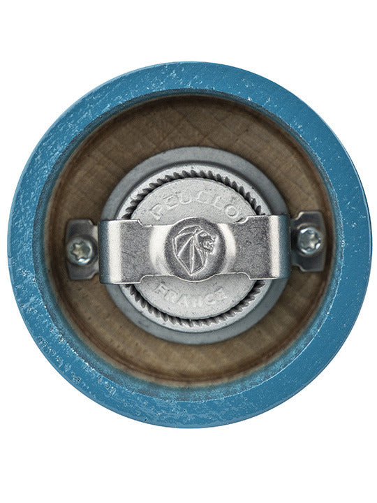 Top view of the Peugeot | Bistro Pepper Mill in Pacific Blue, showcasing its metal adjustment knob and grinding mechanism set into a wooden body.