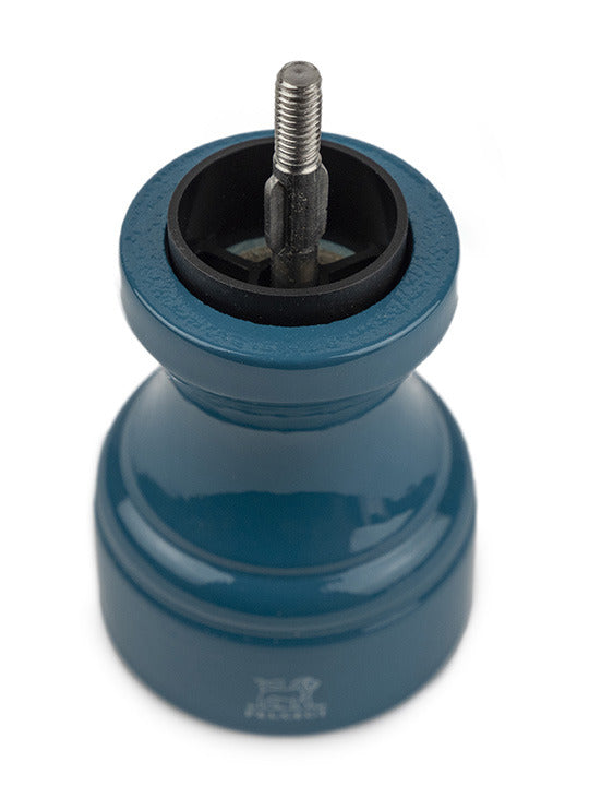 Peugeot | Bistro Pepper Mill, Pacific Blue, featuring a beech wood body with exposed grinding mechanism, viewed from above, ideal for enhancing flavors in culinary settings.