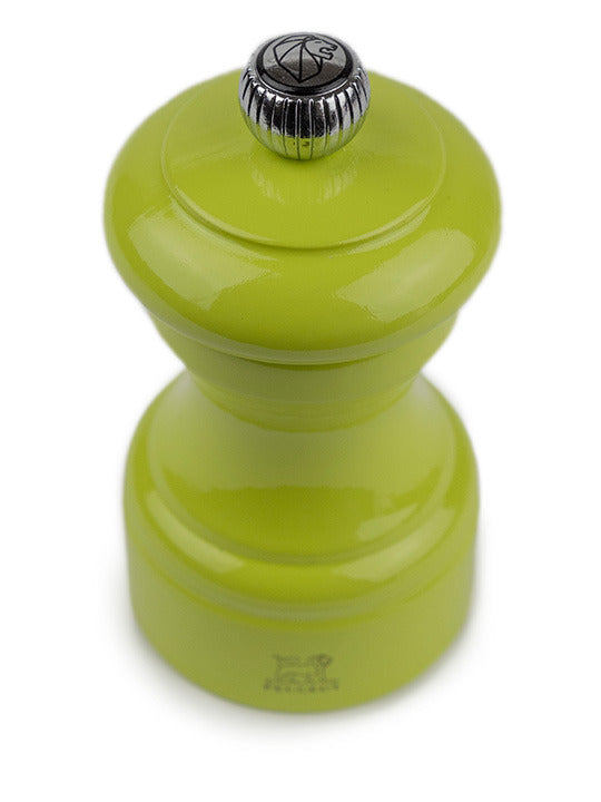 Peugeot | Bistro Pepper Mill, Green Pistachio: Glossy lime-green tabletop grinder with metal adjustment knob, symbolizing French elegance and durability, crafted in France.