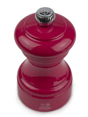 Peugeot | Bistro Salt Mill, Candy Pink with ribbed knob, hourglass shape, premium logo, offering perfect grip and lifetime-guaranteed steel mechanism for easy grind adjustment.