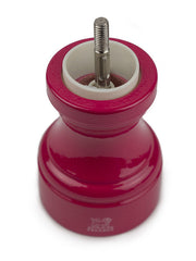 Peugeot | Bistro Salt Mill, Candy Pink, showing its red-painted body, steel mechanism, and ergonomic grip design for precise salt grinding.