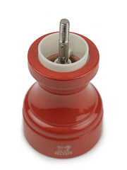 Peugeot | Bistro Salt Mill, Terracotta, with a visible ceramic and metal grinding mechanism, showcasing its glossy red beech wood design, ideal for French-style café ambiance.