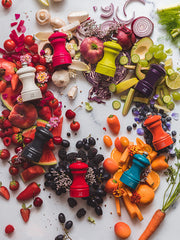 Peugeot | Bistro Pepper Mill, Pacific Blue, showcased in a vivid display with matching produce, highlighting its role in vibrant culinary presentations.