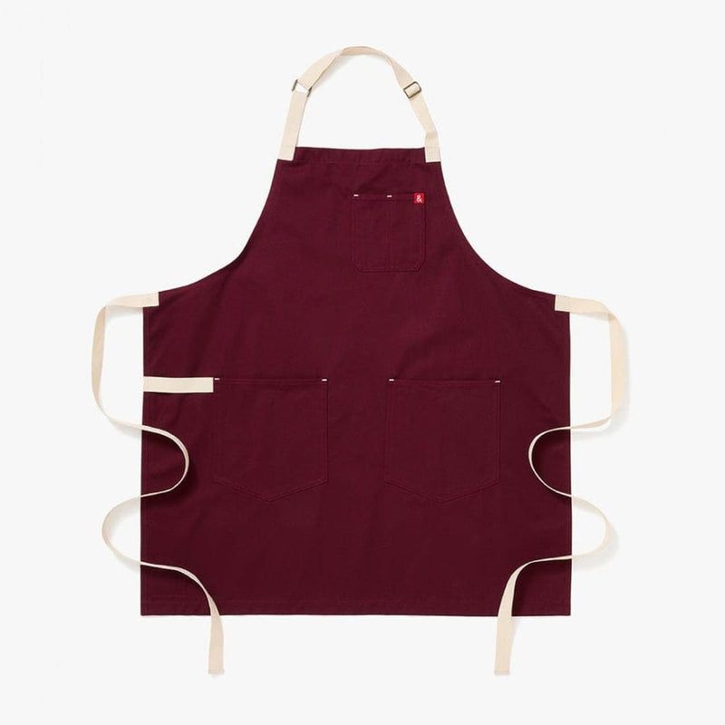 Hedley & Bennett | Essential - House Red apron with adjustable neck strap, two waist pockets, and a chest pocket, ideal for cooking or crafting.