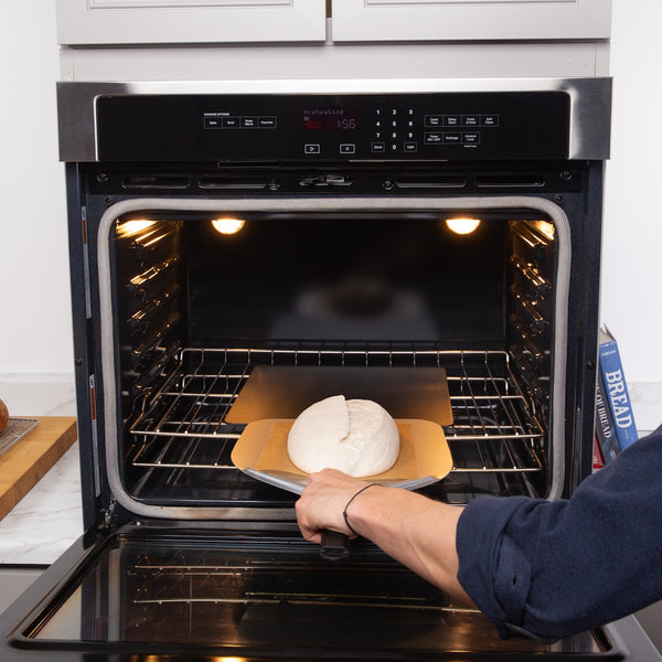 Brod & Taylor Metal Bread Peel displayed on a countertop, showcasing its sleek design and sturdy construction, ideal for handling and transferring baked goods efficiently.