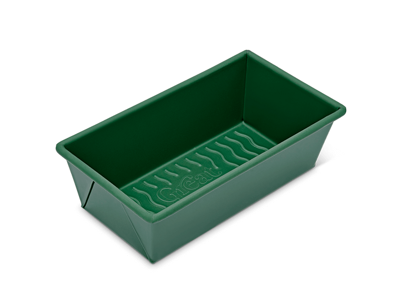 Close-up of the Great Jones | Breadwinner loaf pan with a corrugated bottom, designed for easy baking and cleaning with a nonstick, nontoxic ceramic coating.