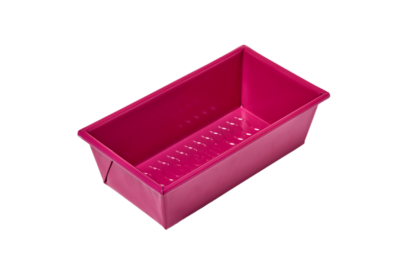 Great Jones | Breadwinner - Raspberry loaf pan with a nonstick, nontoxic ceramic coating and wavy, corrugated bottom for easy release of baked goods.