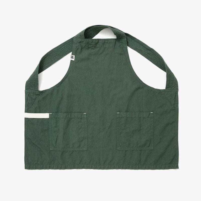 Hedley & Bennett | Smock - Broccolini apron, featuring wide neck straps, two large front pockets, and a white-trimmed side pocket, ideal for kitchen use.