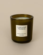 Caroline Francis - Horizons After Rain candle in a glass container, featuring a label and logo, hand-poured with clean coconut soy wax for a soothing ambiance.