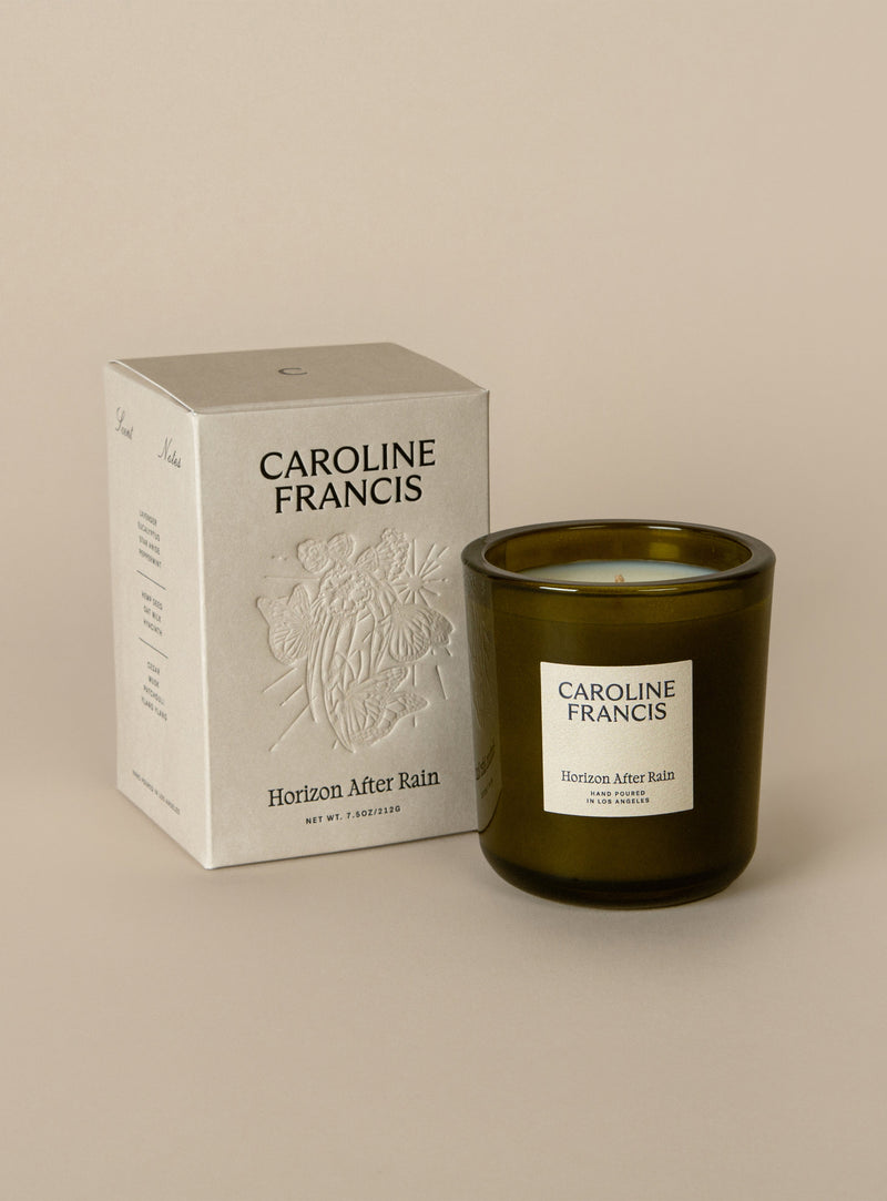 Caroline Francis - Horizons After Rain candle in a glass jar with a decorative box, featuring a soothing scent blend of nature-inspired aromas.