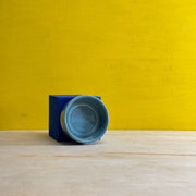 Bergs Potter | Hoff Glazed Collection saucer in Misty Blue, showcasing Scandinavian design with a minimalistic, modular form, perfect for contemporary kitchen decor and functionality.