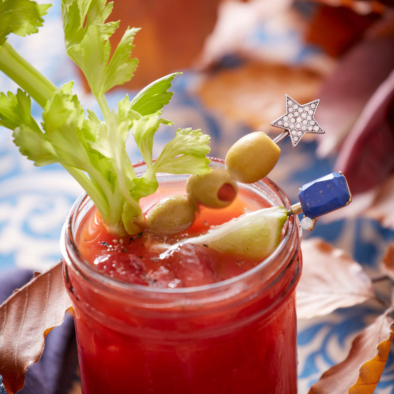 Close-up of Joanna Buchanan | Cocktail Picks - Bright Gem, showcasing vibrant jewel-tone tops on stainless steel picks, perfect for enhancing cocktails or cheese boards.