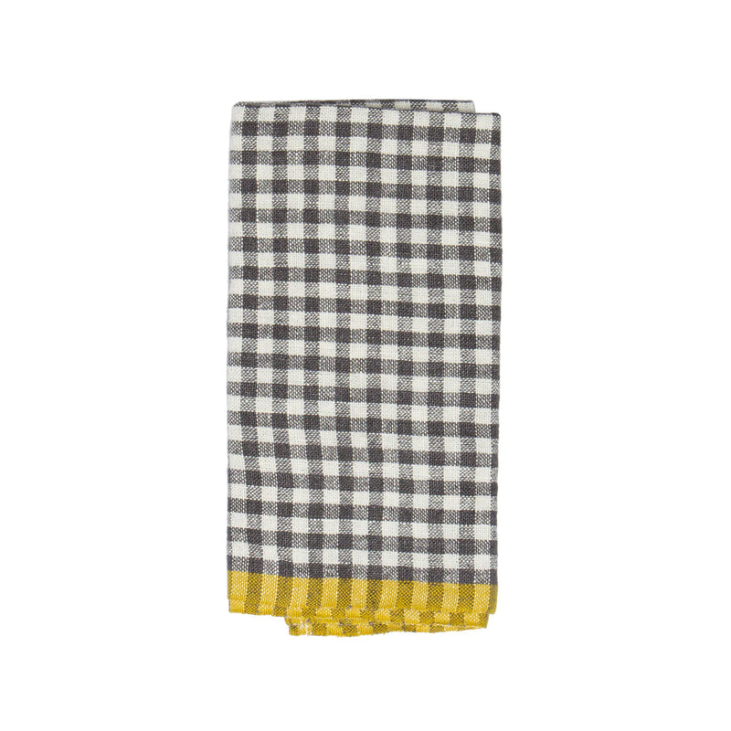Caravan Home | 20 x 30 Gingham Grey & Dijon Towels: A folded tea towel with a black-and-white checkered pattern and a yellow border, ideal for a sunny kitchen.