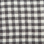 Close-up of Caravan Home's 20 x 30 Gingham Grey & Dijon Towels, showcasing a woven black-and-white check pattern, ideal for brightening kitchens or bathrooms.
