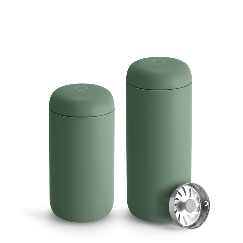 FELLOW | Carter Move Mug, Smoke Green / 16 oz, set with a stainless-steel strainer, ideal for maintaining drink temperature and flavor on-the-go.