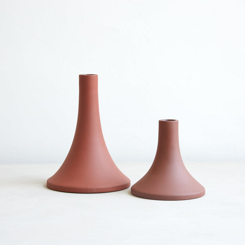 The Floral Society | Candle Holders, Grand, Matte White Tall, featuring two minimalist ceramic forms with wide bases and narrow tops, perfect for standard taper candles.