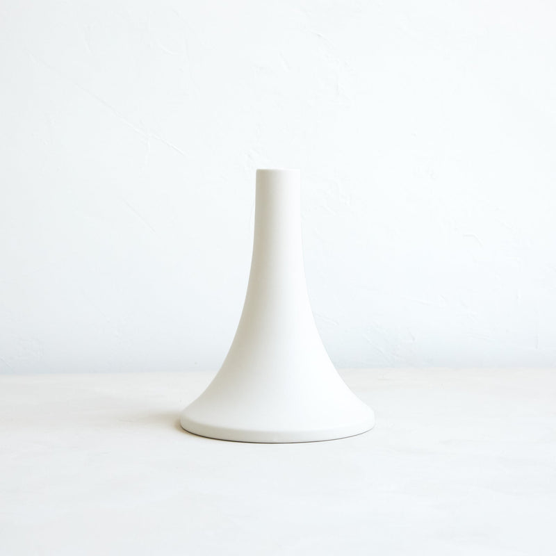 The Floral Society | Candle Holders, Grand, Matte White Tall: A minimalist white ceramic holder with a slender neck and flared base, designed for standard taper candles.