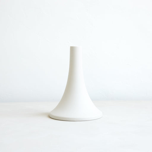 The Floral Society | Candle Holders, Grand, Matte White Tall: A minimalist white ceramic holder with a slender neck and flared base, designed for standard taper candles.