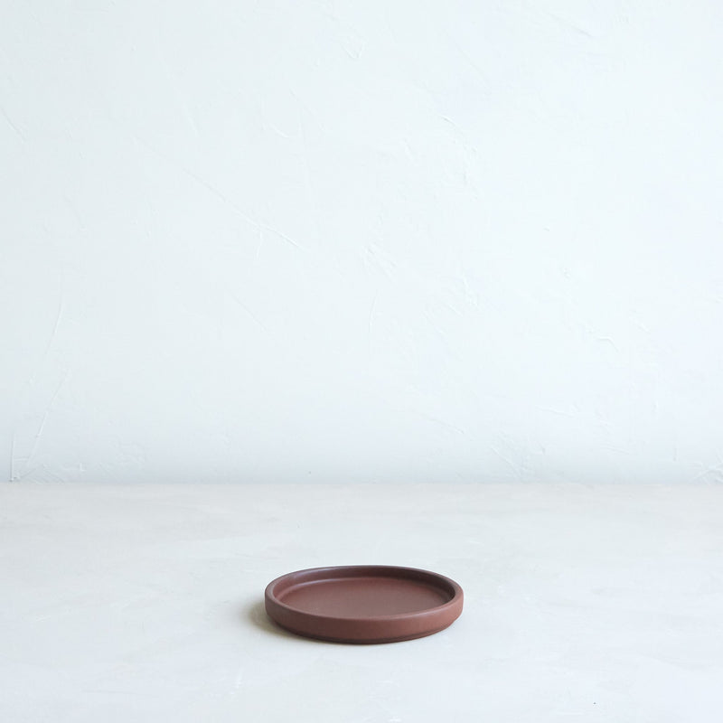 The Floral Society | Daily Plate, Sand—a low-profile round terracotta dish, ideal for holding candles or as a multi-purpose accent piece.