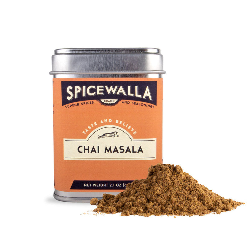 Spicewalla | Chai Masala tin with a mound of spiced tea blend, inspired by Indian street flavors, ideal for brewing chai or enhancing desserts.