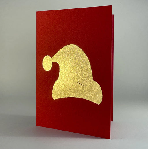 Catherine Greenup Cards - Oak Leaf on Brown features a red card with a gold foil-stamped Santa-hat silhouette, perfect for holiday gifting from Athens Cooks.
