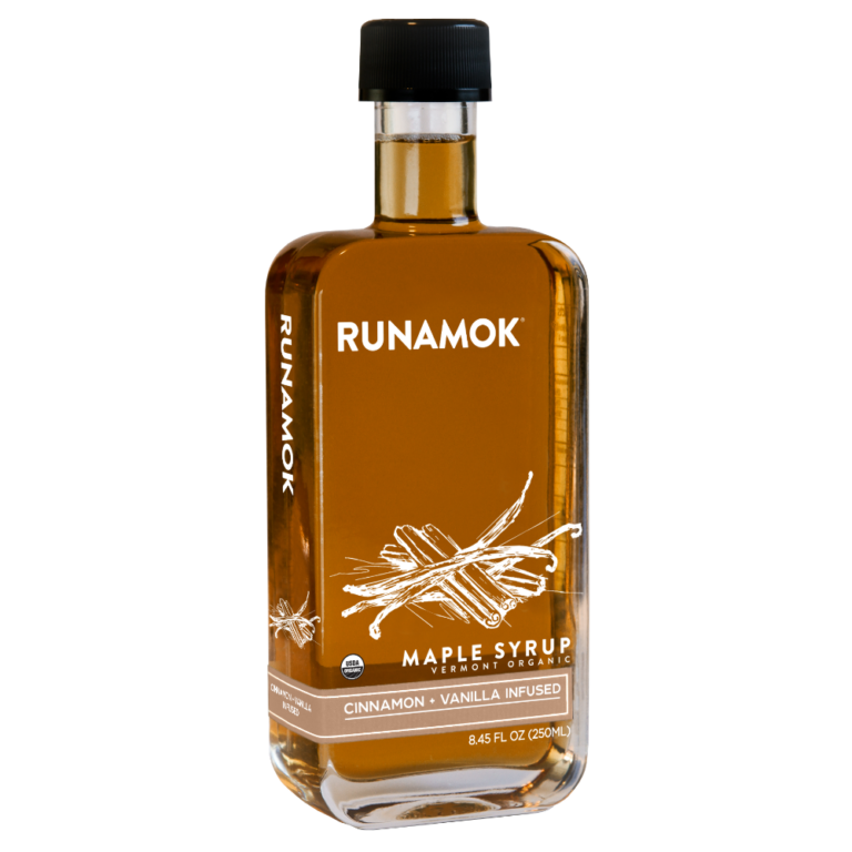 Runamok's Cinnamon + Vanilla Infused Maple Syrup in a glass bottle, ideal for enhancing pancakes or coffee with warm, spiced flavors.