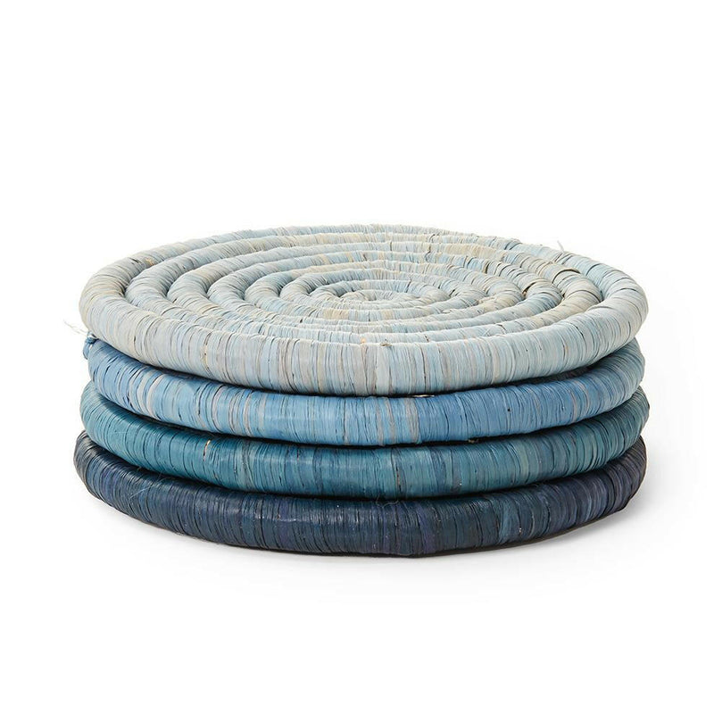 St. Frank | Ombré Coaster Collection - Blue: a stack of handcrafted woven coasters, showcasing traditional basket weaving techniques, tied with a black grosgrain ribbon for elegant presentation.