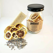 Piedmont Provisions | Cocktail Infusion Kits - Bourbon Peach Smash, featuring a cut lemon, label close-up, and dried lemon slices, ideal for crafting hand-crafted cocktails.