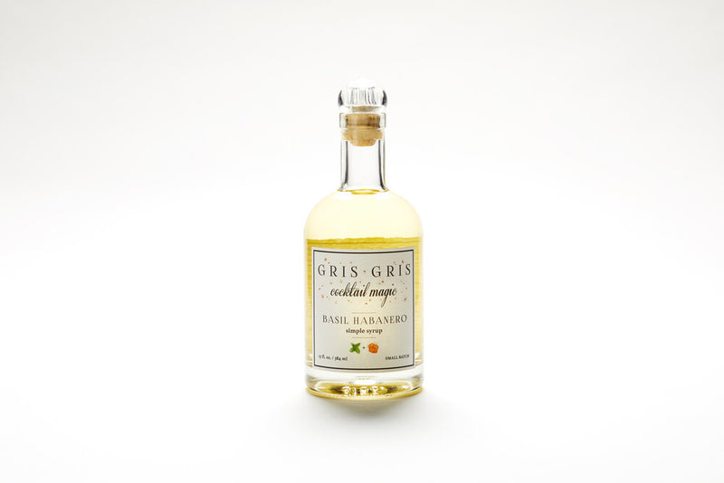 Basil Habanero mixer bottle, showcasing Gris Gris Cocktail Magic Simple Syrup, crafted for enhancing cocktails with a spicy, aromatic blend of fresh basil and habaneros.