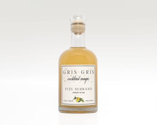 Gris Gris | Cocktail Magic Simple Syrup - Yuzu Serrano in a glass bottle with cork, featuring a white label, ideal for enhancing cocktails with a spicy, aromatic twist.