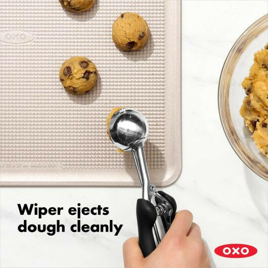 OXO Cookie Scoops - Large: Stainless steel scoop with non-slip grip and spring-loaded handle for easy dough release, ideal for making uniform, 2.75-inch cookies.