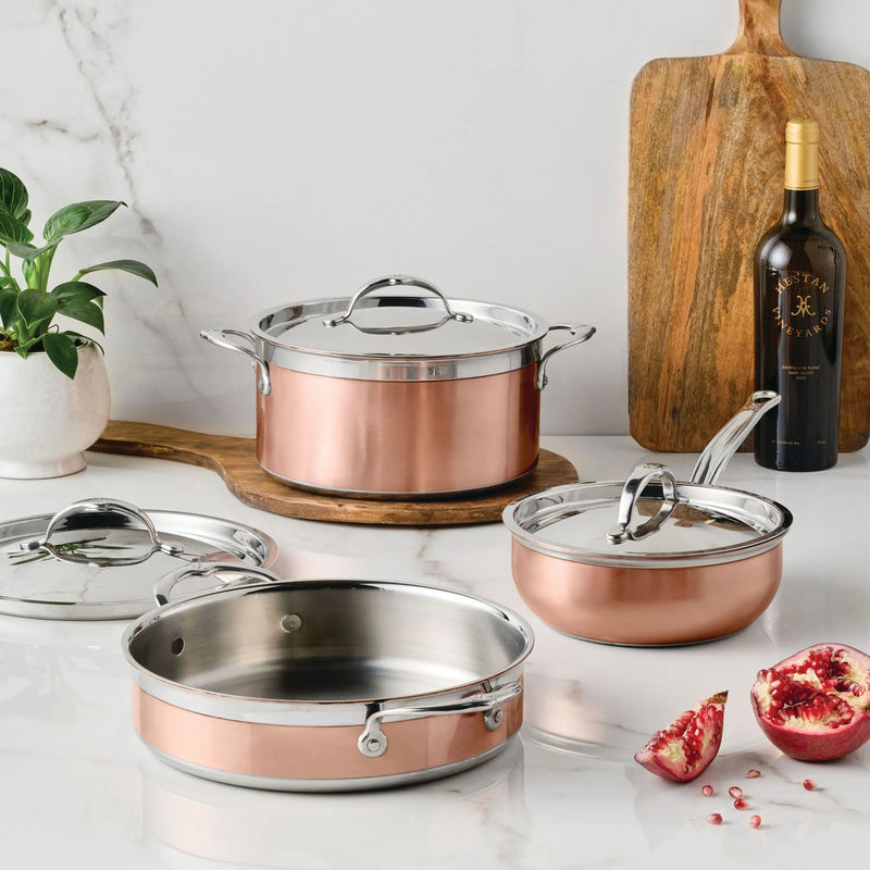 Hestan Provisions | Stainless Steel Lids Large, 12.5 showcased with copper cookware on a marble countertop, emphasizing durability and ergonomic design for optimal kitchen performance.