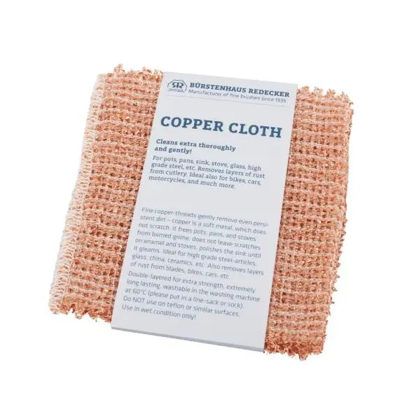 Redecker Copper Cleaning Cloth, Set of 2, folded with packaging detailing its non-scratch, multi-surface cleaning capabilities, ideal for kitchen use.
