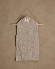 Coral & Tusk | Christmas Clock Advent Calendar features a linen wall pouch with a red coral patch, designed for festive organization with 25 hidden pockets.