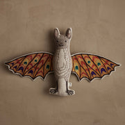 Coral & Tusk | Bat Surprise Doll with colorful embroidered wings open, revealing butterfly design, laid flat. Features magnet for wings closure.