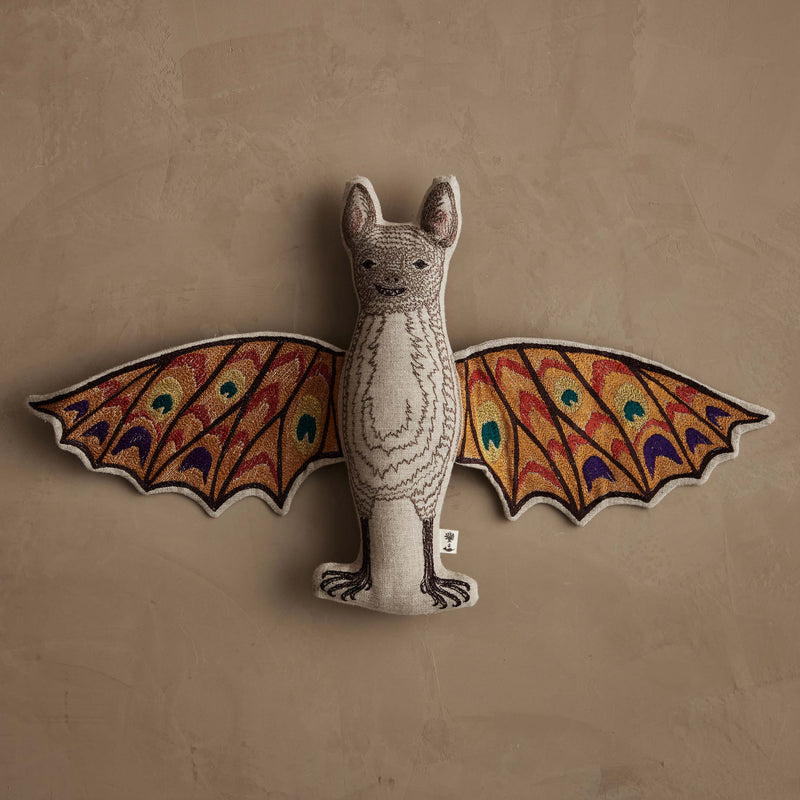 Coral & Tusk | Bat Surprise Doll with colorful embroidered wings open, revealing butterfly design, laid flat. Features magnet for wings closure.