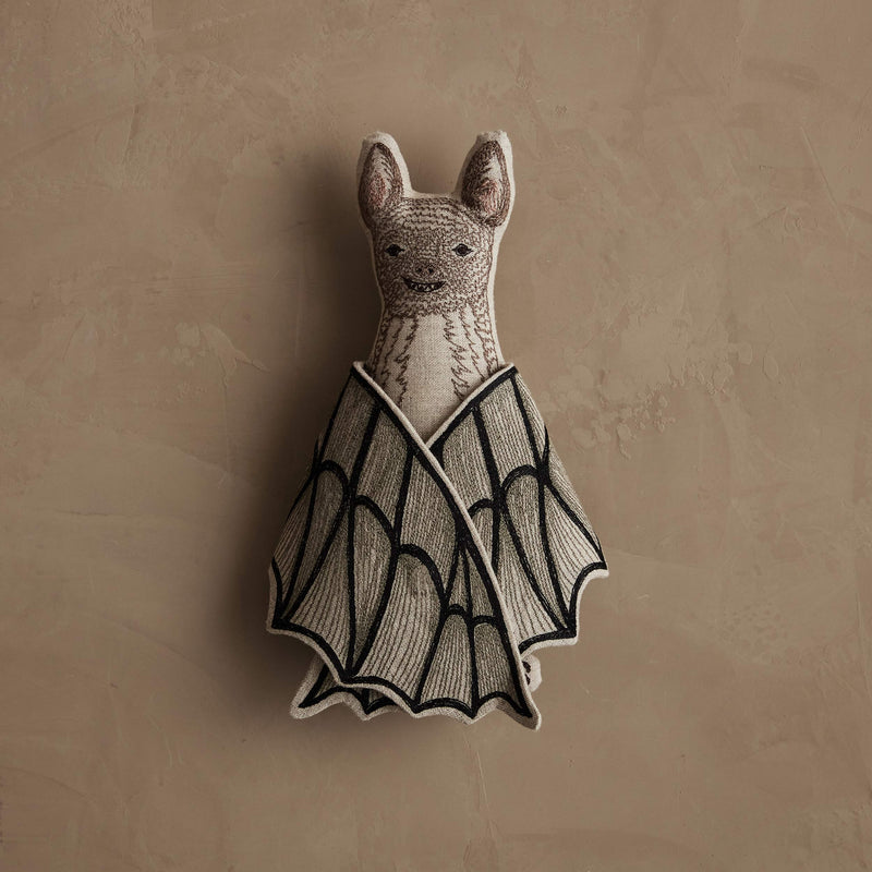 Coral & Tusk | Bat Surprise Doll: Plush bat toy with embroidered face, knitted wings revealing a butterfly motif, featuring a magnet for wing closure.