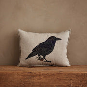 Coral & Tusk | Blackbird with Acorn Pillow: Linen pillow with embroidered crow, acorn, and sprig, embodying rustic charm and new beginnings.