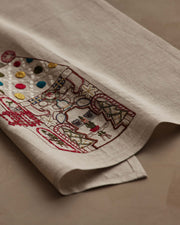 Coral & Tusk | Cookie Workshop Tea Towel featuring festive embroidery with Christmas motifs, perfect for adding holiday charm to your kitchen or powder room.