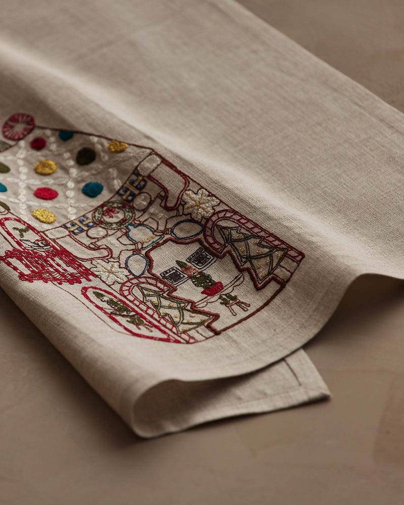 Coral & Tusk | Cookie Workshop Tea Towel featuring festive embroidery with Christmas motifs, perfect for adding holiday charm to your kitchen or powder room.