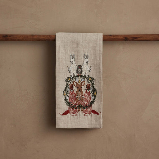 Coral & Tusk | Togetherness Tea Towel featuring embroidered woodland animals and a pine-needle wreath, perfect for adding a festive touch to your kitchen.