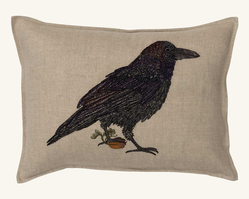 Coral & Tusk | Blackbird with Acorn Pillow: Beige linen cushion featuring an embroidered blackbird with a sprouting acorn, symbolizing new beginnings. Includes pillow cover with insert.