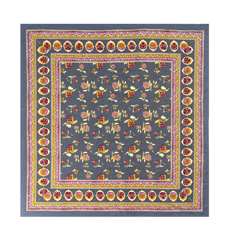 Close-up of the Caravan Home 71 x 71 Pansy Red & Grey Tablecloth featuring intricate floral and abstract patterns, handprinted by artisans.