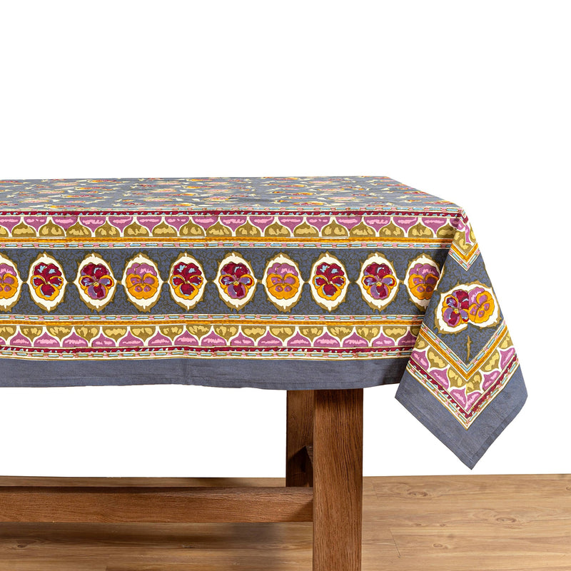 Caravan Home | 71 x 71 Pansy Red & Grey Tablecloth, showcasing intricate floral and abstract patterns, handprinted on French linen, enhancing any dining setting.